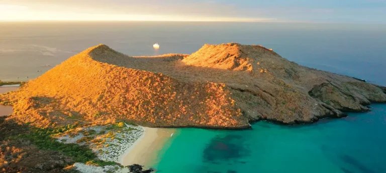 Aerial view of Floreana Island's coastline at sunset, Galápagos