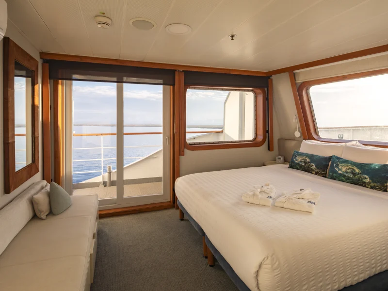 Balcony Suite cabin with private terrace aboard the Galápagos Legend