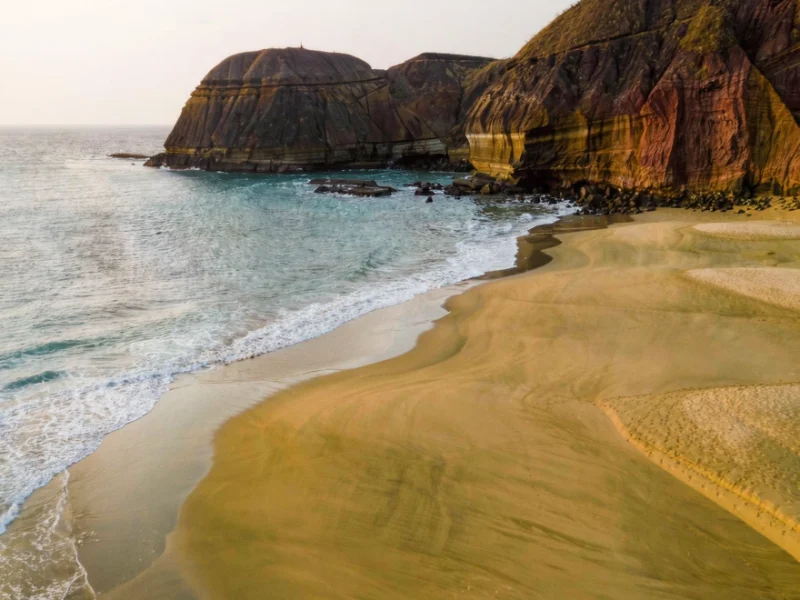 The golden and reddish cliffs of Punta Pitt, San Cristóbal